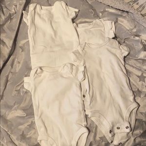 4 white new born onesies